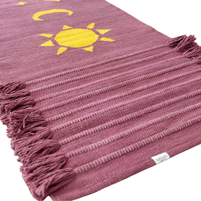 Handwoven organic cotton yoga mat with sun, moon, and stars design, naturally dyed with Ayurvedic sappanwood for conscious, sustainable, and chemical-free meditation practice.